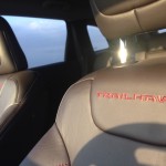 Trailhawk sporting black-leather seats with read stitching.