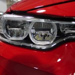 2016 BMW M4 Coupe Ferrari Red - Up close and personal with the BMW's headlight